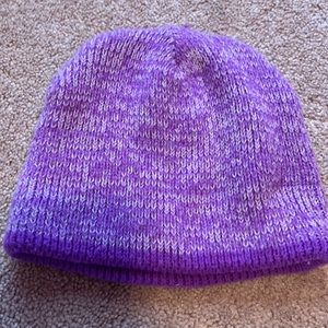 Hi! This is a purple hat with white specks on it.